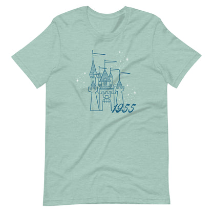 Dusty blue t-shirt printed with vintage style sketch of a Castle with the year 1955 and pixie dust above the castle.