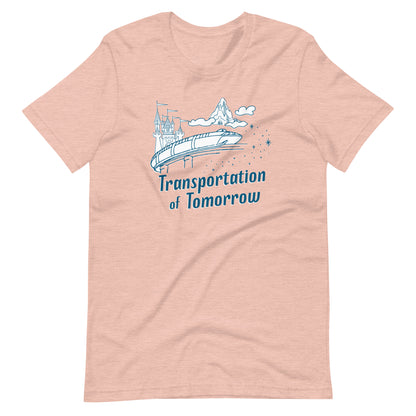 Peach shirt printed with vintage style sketch of the Matterhorn, Castle, and Monorail with pixie dust. The shirt says Transportation of Tomorrow.