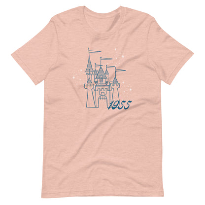 Peach t-shirt printed with vintage style sketch of the Disneyland Castle with the year 1955 and pixie dust above the castle.