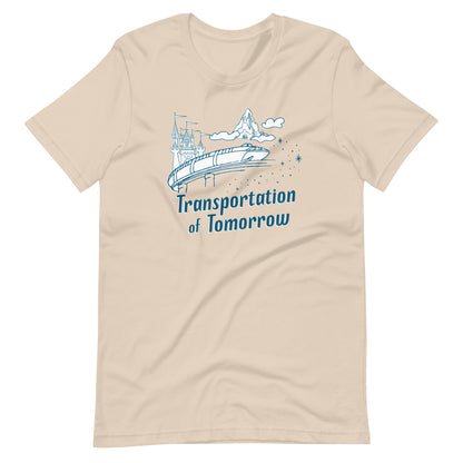 Cream shirt printed with vintage style sketch of the Matterhorn, Castle, and Monorail with pixie dust. The shirt says Transportation of Tomorrow.
